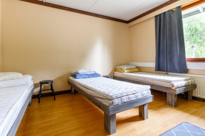 The large three-person bedroom on the upper floor of Evo Grand Villa.