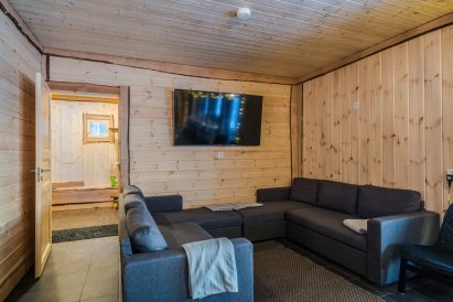 The sofa corner in the main hall of Aulanko Lake Villa. The sofas can also be used as sofa beds.