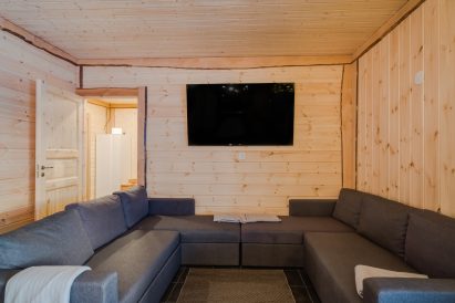 The sofa corner in the main hall of Aulanko Lake Villa. The sofas can also be used as sofa beds.