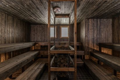 The spacious sauna room of Aulanko Grand Villa's indoor sauna section.