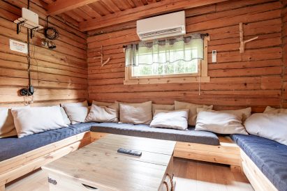 The U-shaped sofa group in the living room at the other end of Evo Wilderness Villa's main hall can also be used as extra beds.