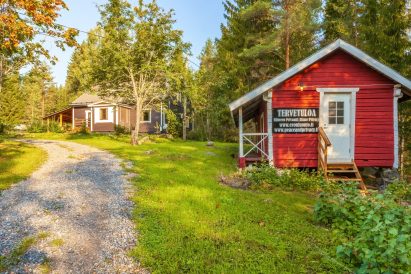 The old log outbuildings at Tavastia Privacy evoke the area's past as a traditional Tavastia farm.