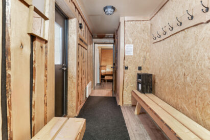 The dressing room of the indoor sauna section at Tavastia Privacy, with direct access to the covered outdoor terrace and the warmth of the hot tub.