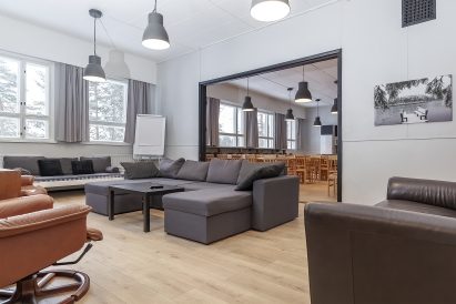 At the end of the main hall of Räyskälä Grand Villa, there is a spacious and cozy living room.