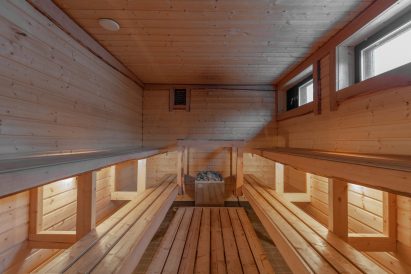 Spacious electric sauna of Villa Springrock's main sauna compartment.