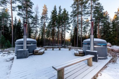 Loppi Wilderness Villa's terrace has two wood-heated hot tubs.