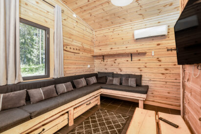 The living room of Loppi Wilderness Villa's Mini Villa, whose sofas can also be used as beds.