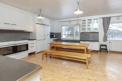 Räyskälä Grand Villa has three kitchens, with the largest being a spacious living kitchen suitable for preparing meals for even larger groups.